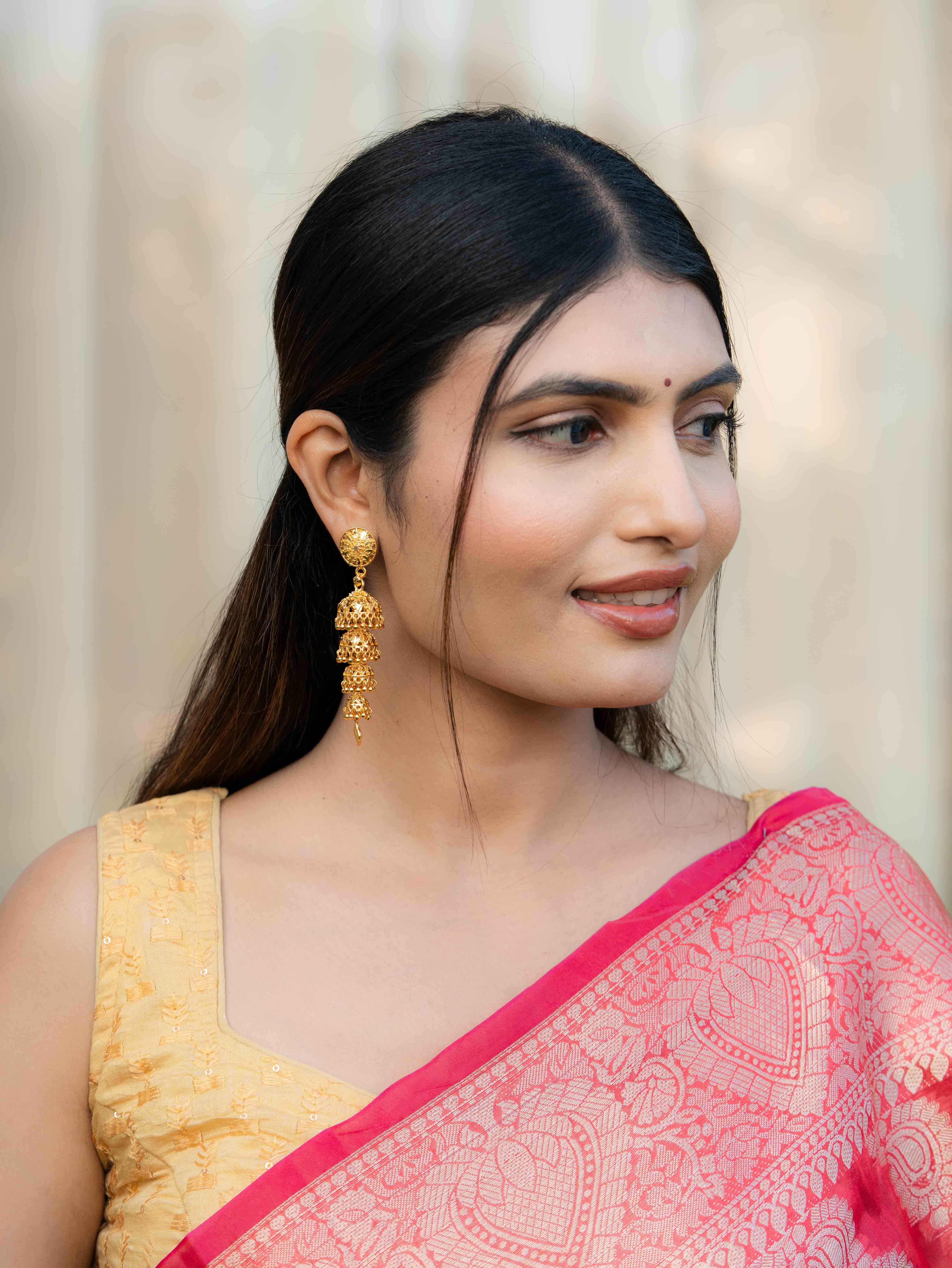 Hemanika Long Gold Earrings