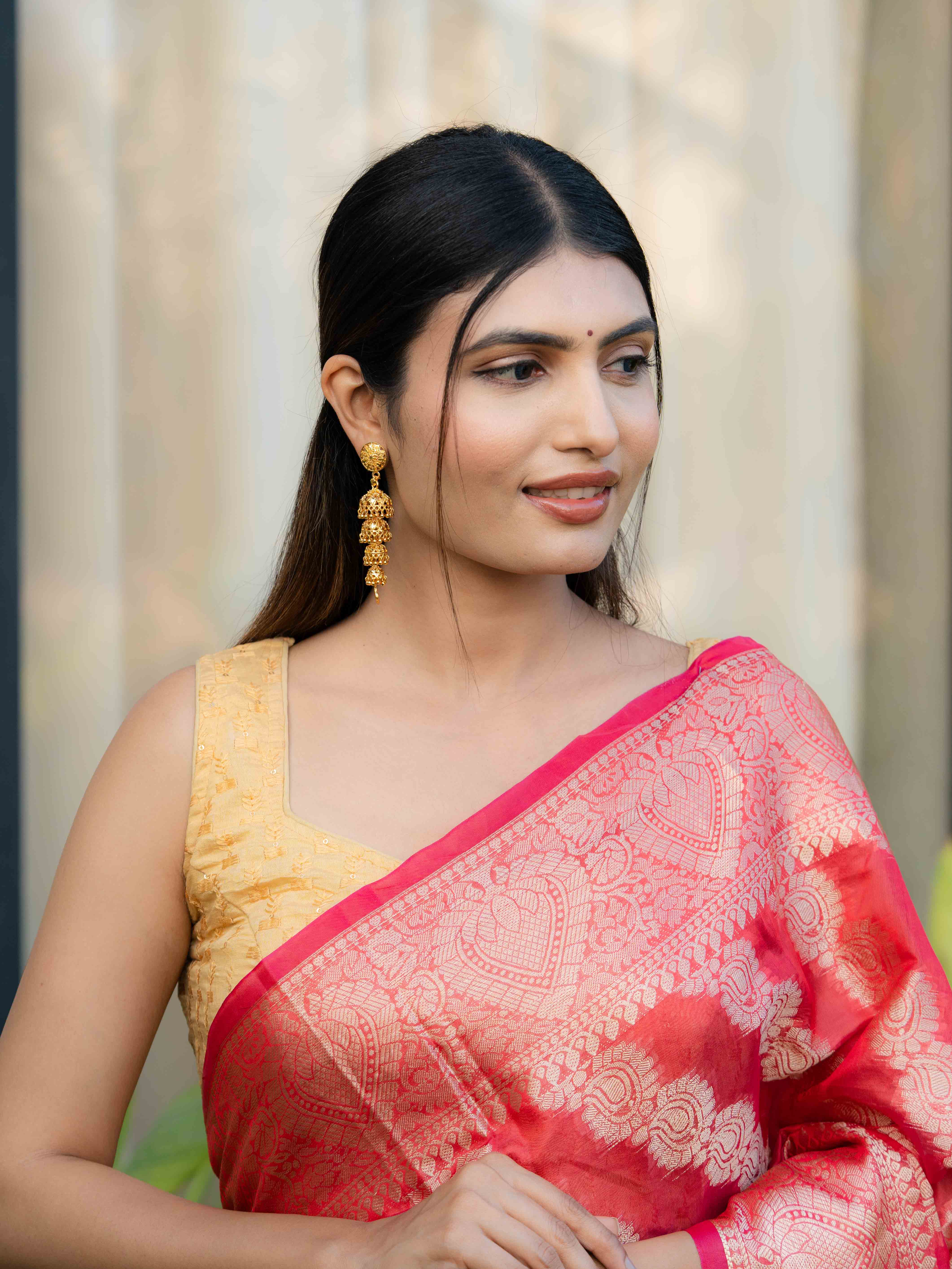 Hemanika Long Gold Earrings